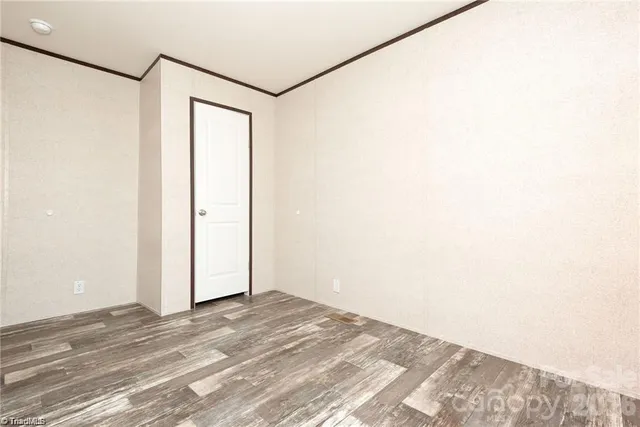 a view of a small space with wooden floor