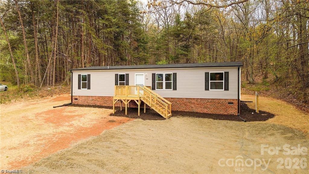 1975 Carl Fox Road Taylorsville, NC 28681 - Photo 2 of 33 a view of a house with backyard and sitting area