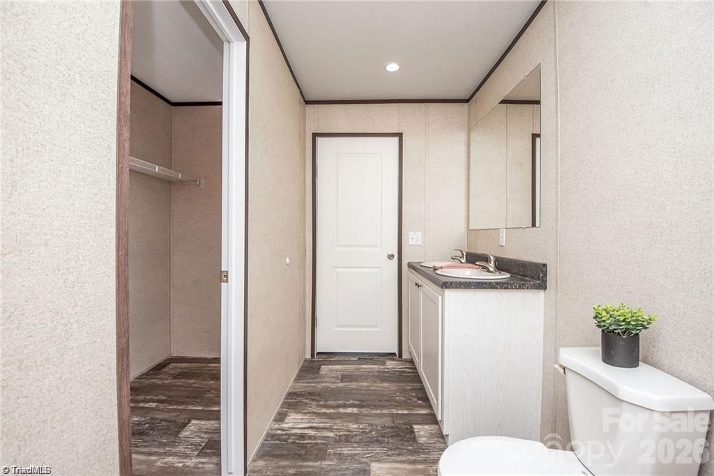 1975 Carl Fox Road Taylorsville, NC 28681 - Photo 25 of 33 a bathroom with a granite countertop sink toilet and shower