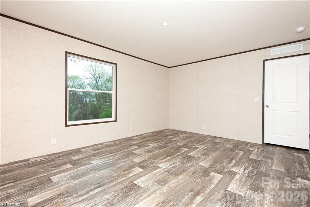 1975 Carl Fox Road Taylorsville, NC 28681 - Photo 26 of 33 a view of a big room with an empty space and a window