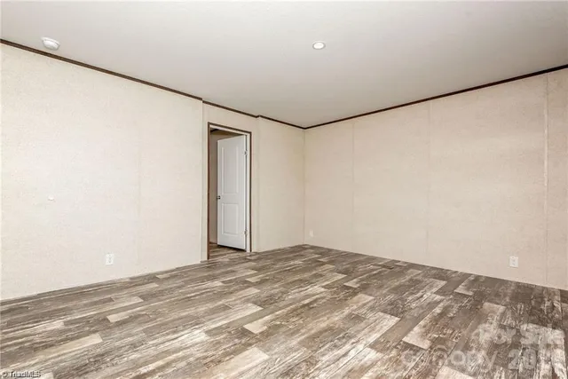 a view of a big room with closet and windows