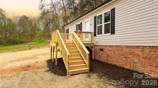 a view of a balcony with two chairs