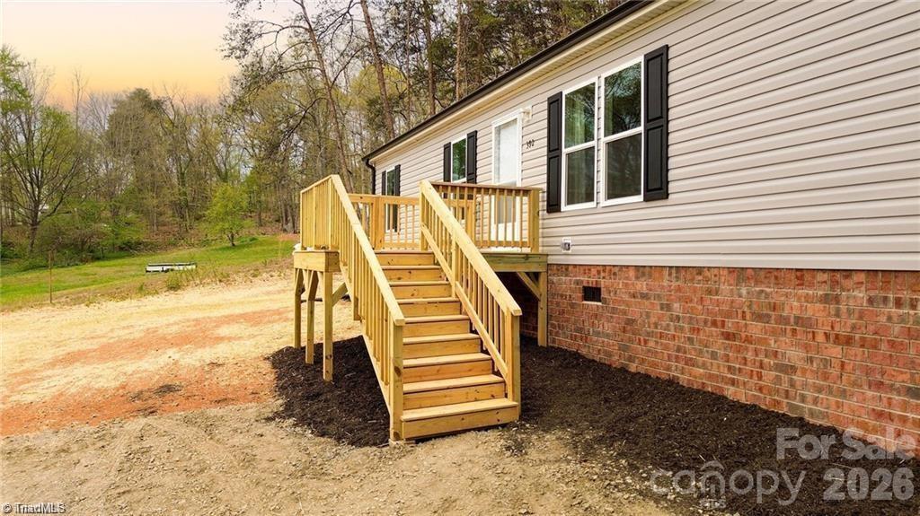 1975 Carl Fox Road Taylorsville, NC 28681 - Photo 3 of 33 a view of a balcony with two chairs