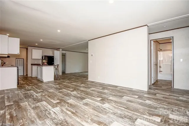 a view of a kitchen with a sink and a refrigerator