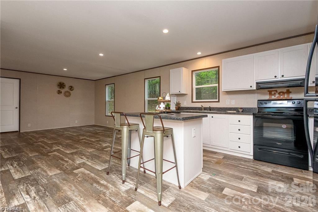 1975 Carl Fox Road Taylorsville, NC 28681 - Photo 7 of 33 a kitchen with a stove a sink and a refrigerator