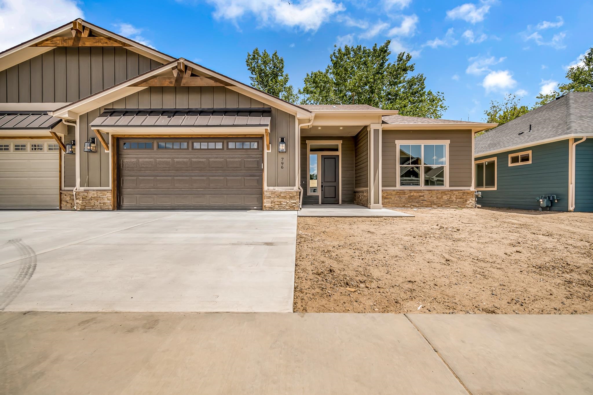 796 Spur Cross Road Grand Junction, CO 81505 - Photo 1 of 24 a front view of a house with a yard