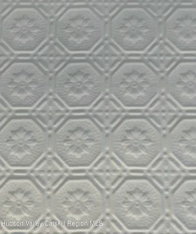 a close up of a white marble wall