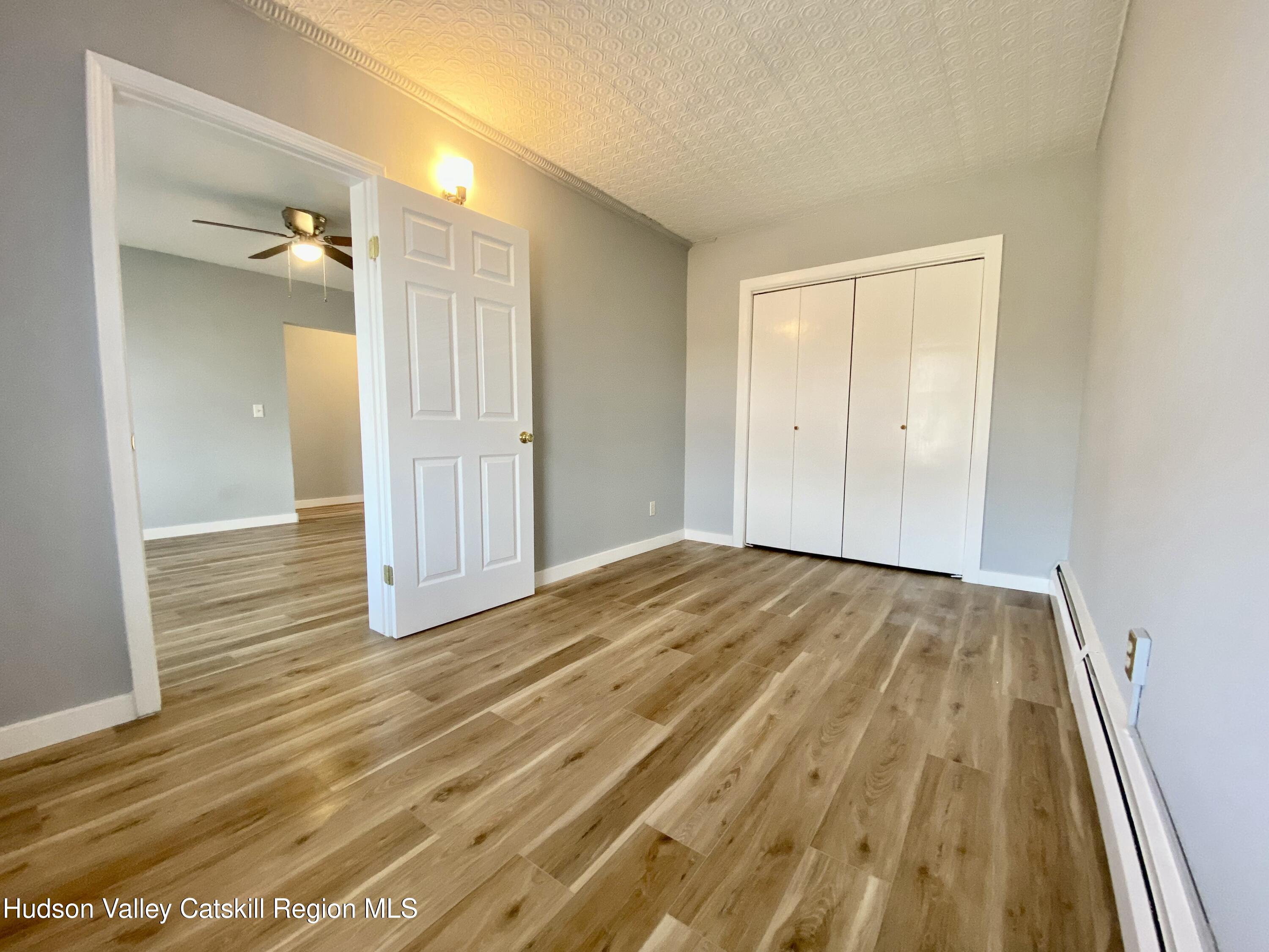 91 Broadway, Unit #2 Kingston, NY 12401 - Photo 8 of 14 a view of a room with wooden floor