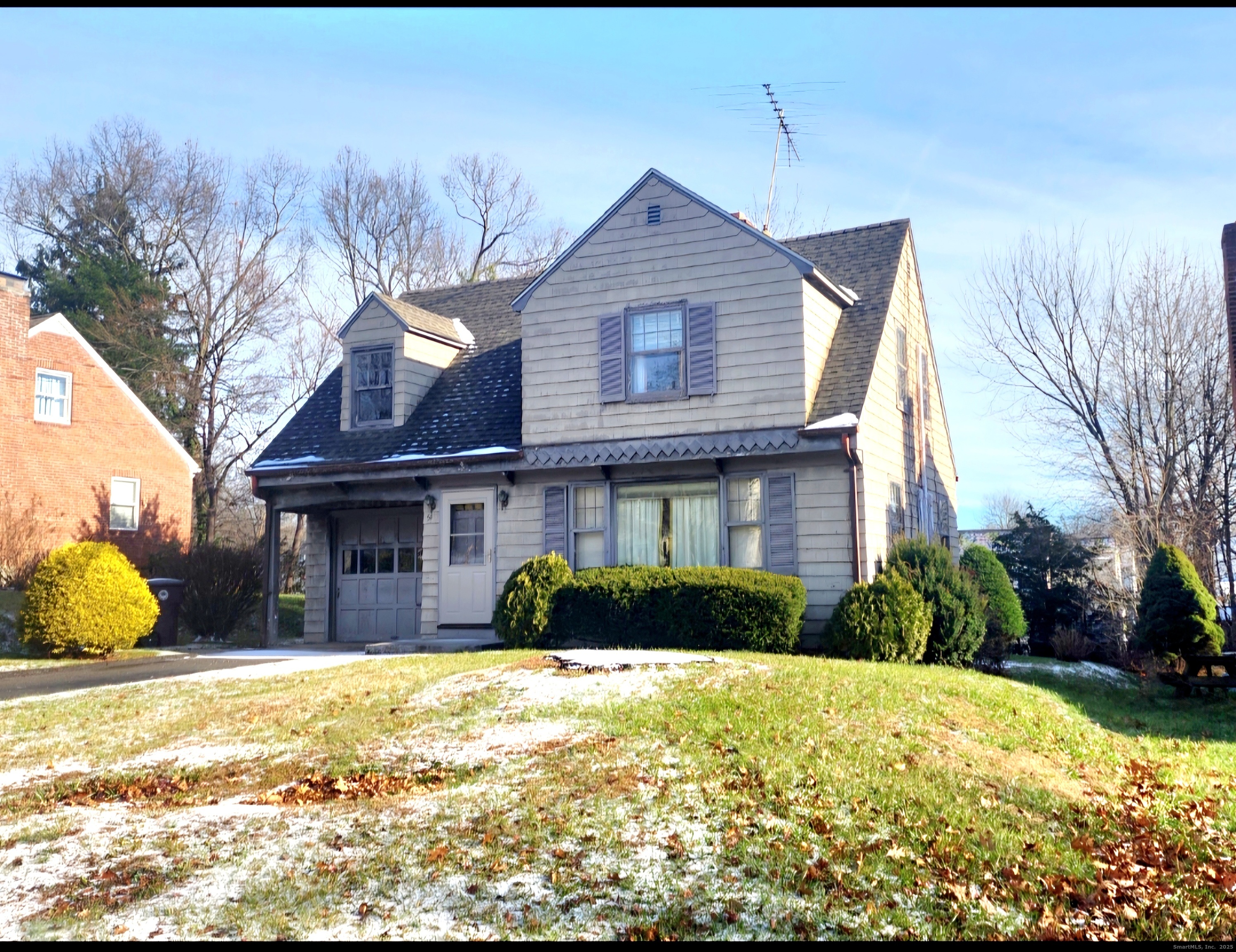 51 Tunxis Street New Britain, CT 06053 - Photo 1 of 18 a front view of a house with a yard