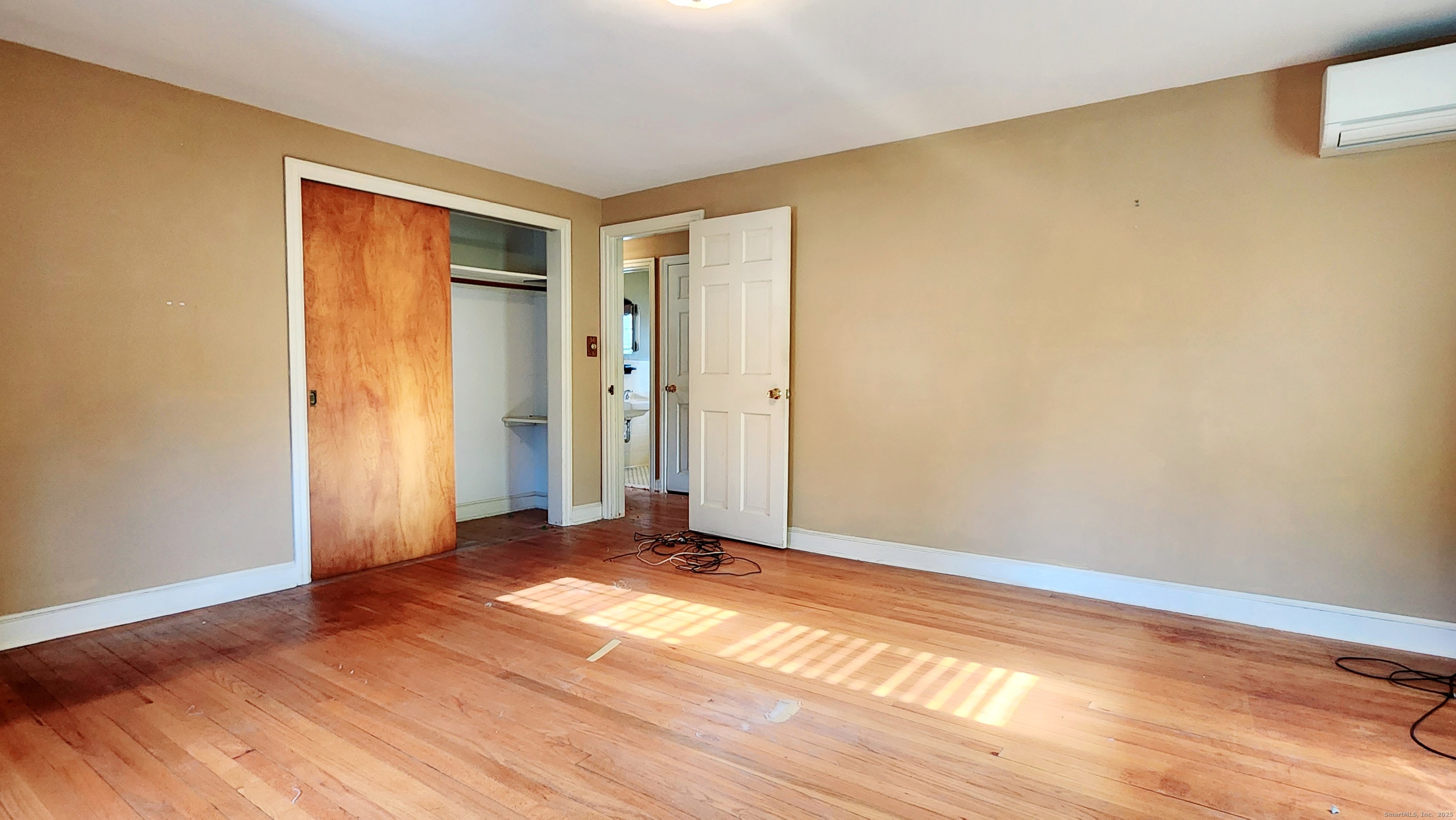51 Tunxis Street New Britain, CT 06053 - Photo 12 of 18 a view of empty room with wooden floor and fan