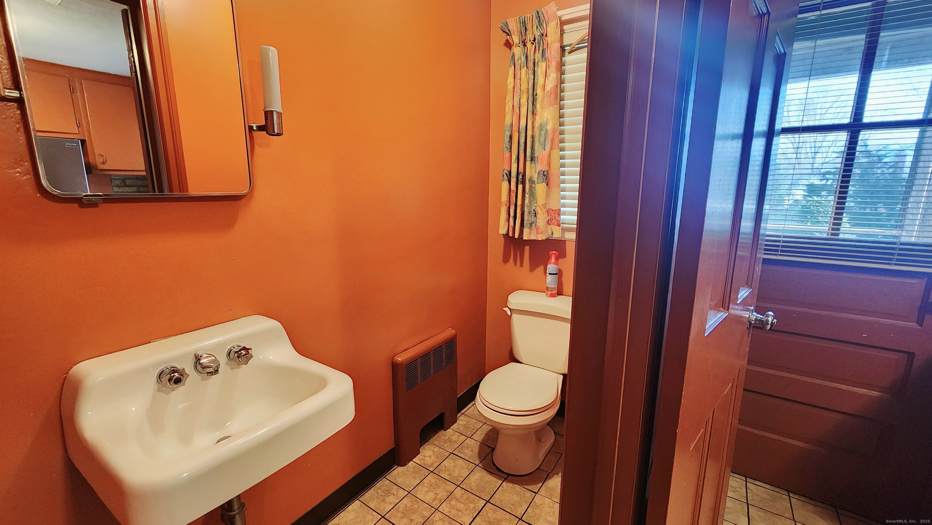 51 Tunxis Street New Britain, CT 06053 - Photo 6 of 18 a bathroom with a toilet sink and mirror