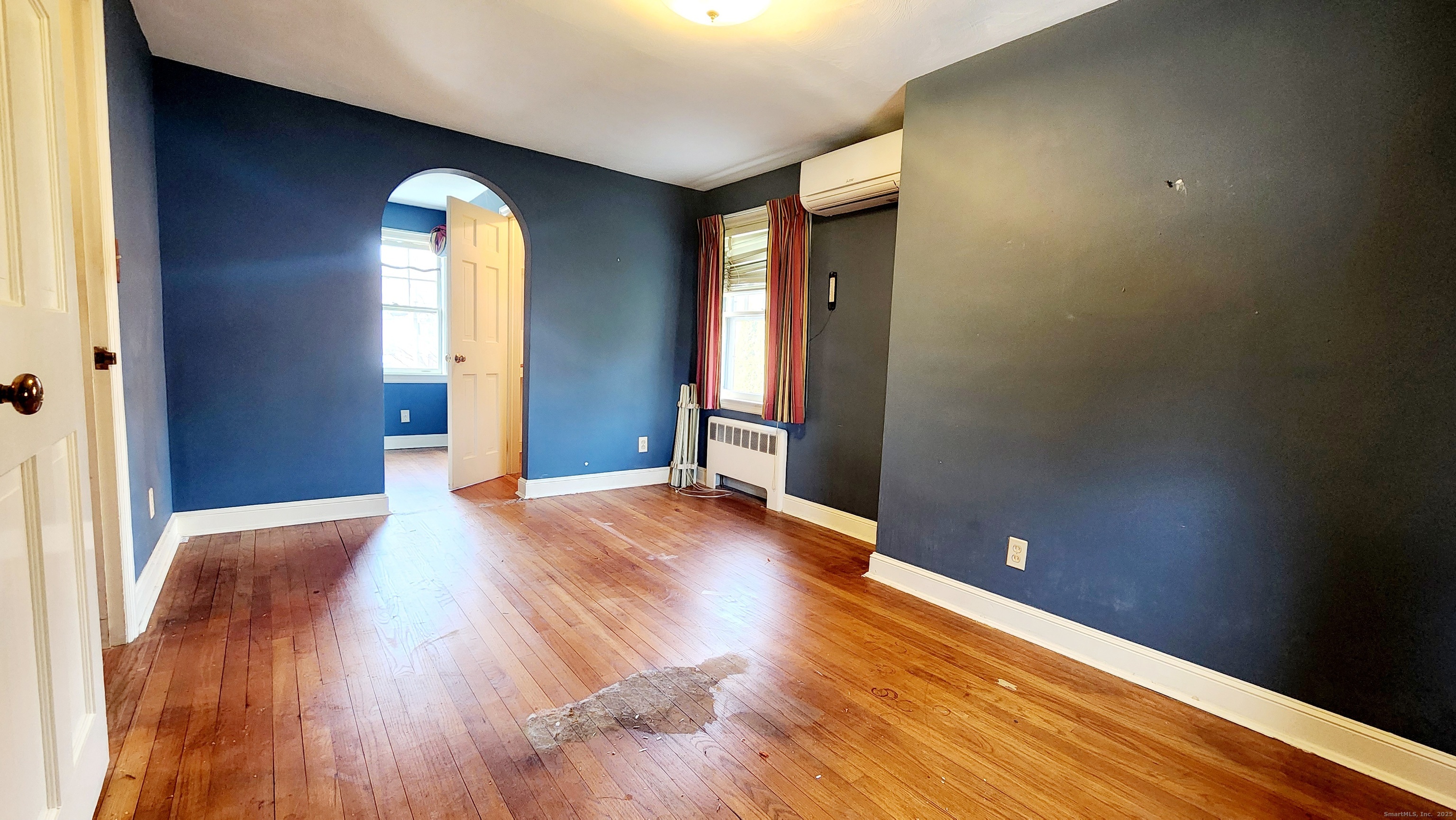 51 Tunxis Street New Britain, CT 06053 - Photo 7 of 18 a view of empty room with wooden floor and fan