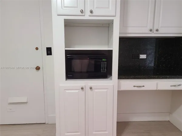 a living room with a fireplace and a flat screen tv