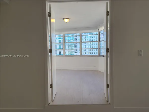 a view of an empty room with a window