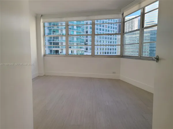 a view of an empty room with a window