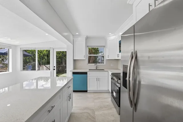 a view of a chandelier fan in a room