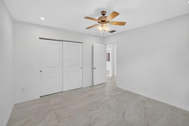 a view of a house with backyard sitting area and garden