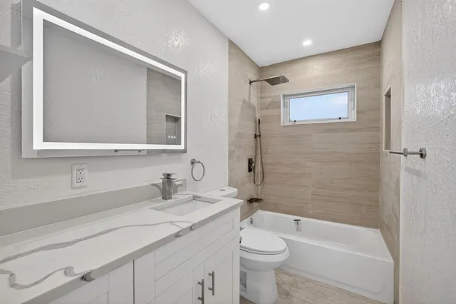 a view of a swimming pool with a table and chairs