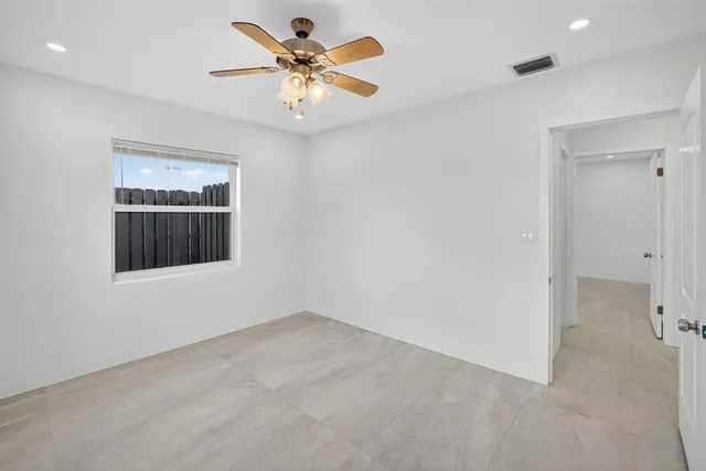 a view of a swimming pool with a lounge chairs