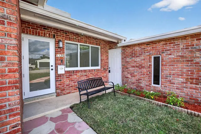 a view of a bench in the backyard