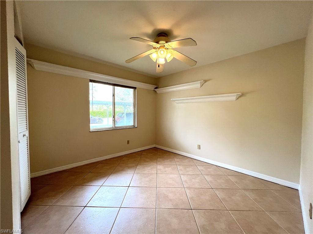 3471 County Barn Road, Unit F102 Naples, FL 34112 - Photo 13 of 19 a view of an empty room with a window