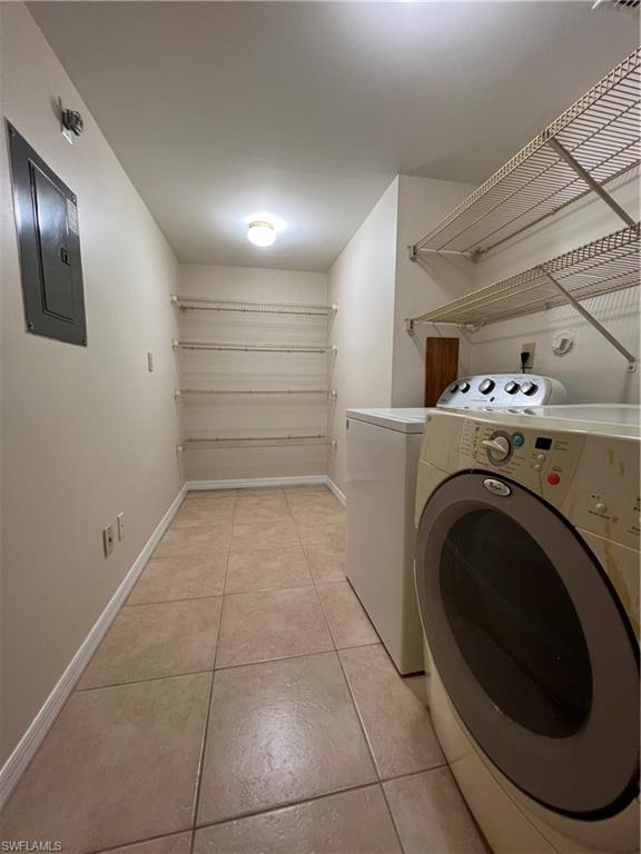 3471 County Barn Road, Unit F102 Naples, FL 34112 - Photo 16 of 19 a view of a storage & utility room with washer and dryer