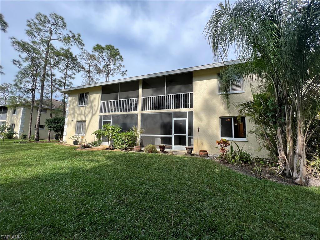 3471 County Barn Road, Unit F102 Naples, FL 34112 - Photo 19 of 19 a front view of house with yard