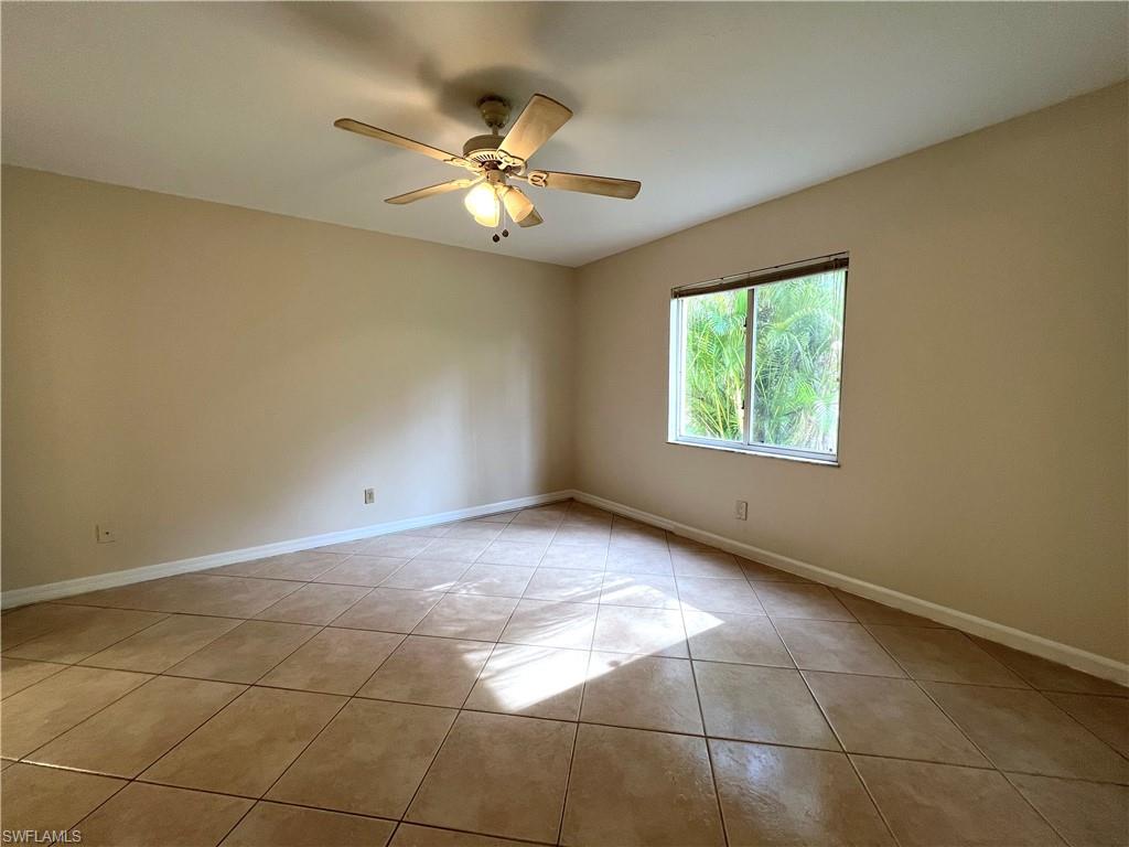 3471 County Barn Road, Unit F102 Naples, FL 34112 - Photo 10 of 19 a view of an empty room with a window