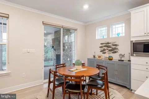 a view of a dining room with furniture and window