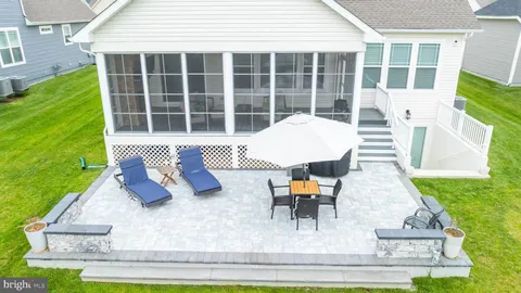 an aerial view of a house with pool