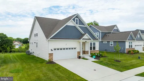 a aerial view of a house with big yard