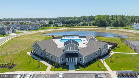 a living room with fireplace furniture and a wooden floor