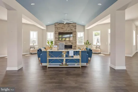 a kitchen with stainless steel appliances granite countertop a refrigerator a stove top oven and sink