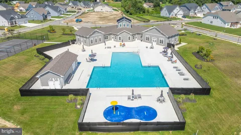 an aerial view of a house with a swimming pool
