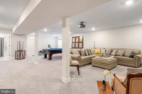 a living room with furniture and a table