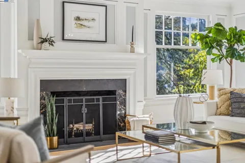 a living room with furniture fireplace and window