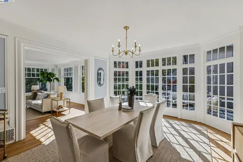 a view of a livingroom with furniture window and wooden floor