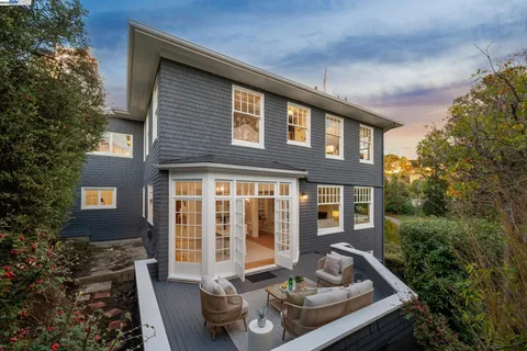 a front view of house with yard outdoor seating and barbeque oven