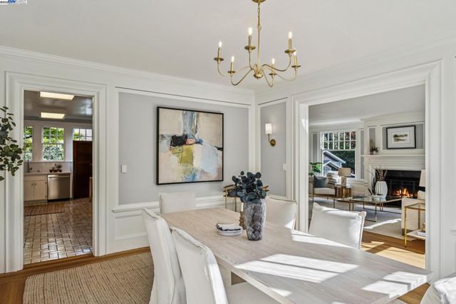 a room with a baby crib and dresser