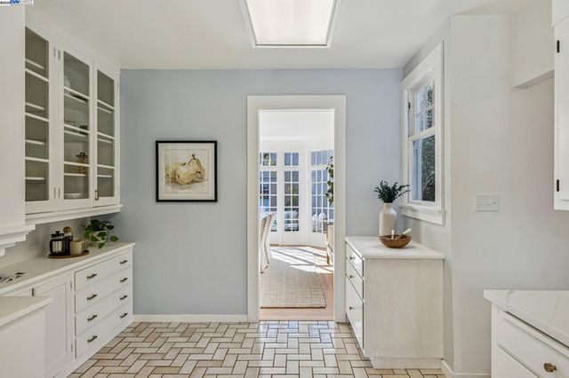 a kitchen with a sink cabinets and window