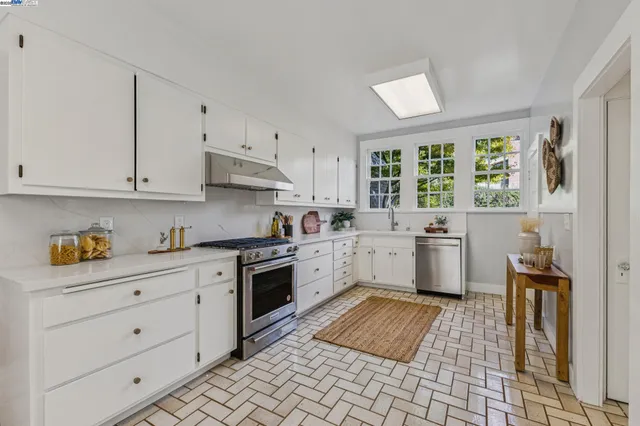 a view of a livingroom with furniture and a window