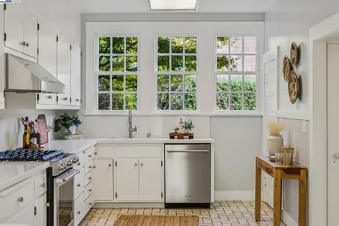 a view of entryway with wooden floor and windows