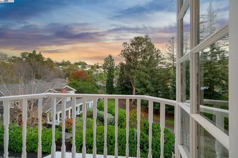 a view of entryway with wooden floor and window