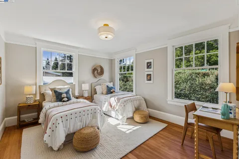 a view of a dining room with furniture and a potted plant