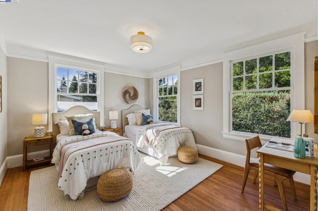 a view of a dining room with furniture and a potted plant