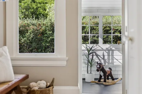 a view of a patio with table and chairs under an umbrella