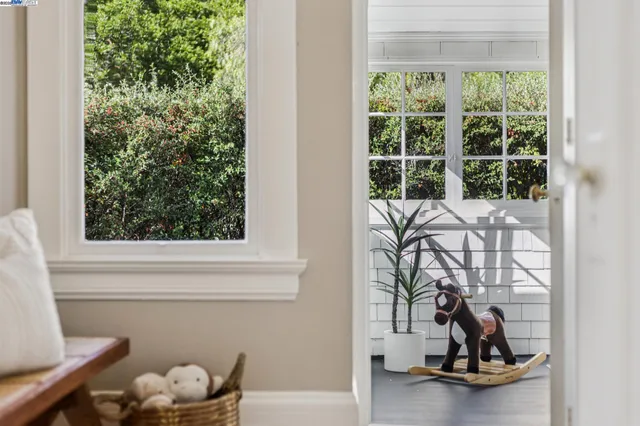 a view of a patio with table and chairs under an umbrella