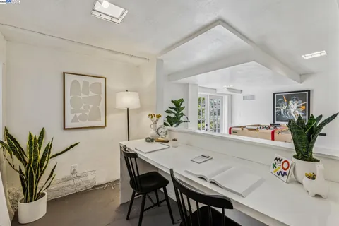 an aerial view of a house with garden space and street view