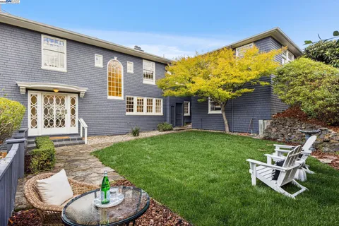 a view of green field with sitting area