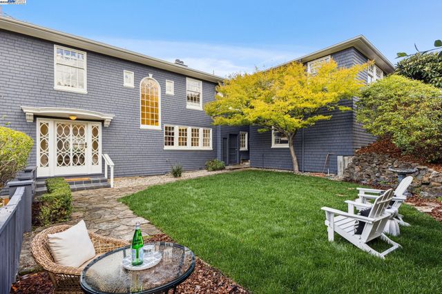 a view of green field with sitting area
